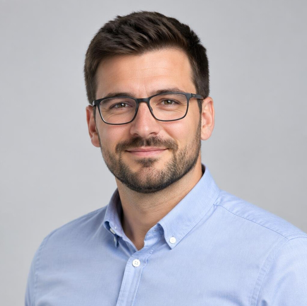 Studio portrait of a Croatian man IT systems analyst wearing glasses