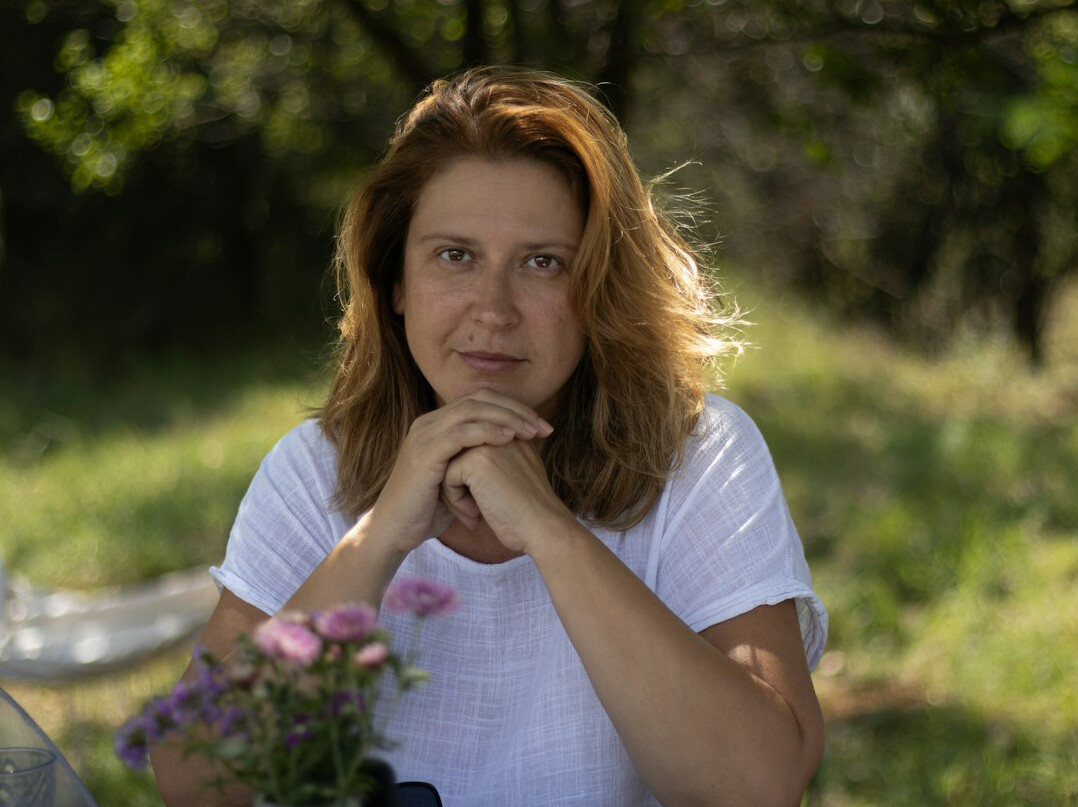 Studio portrait of a Croatian woman project coordinator in a blazer